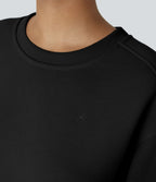 Sweat-shirt décontracté oversize en polaire, col rond, épaules tombantes, manches longues, ourlet fendu, empiècements côtelés contrastés et broderies