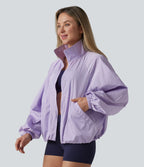 Veste de sport déperlante col montant manches longues zippée avec poches