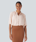 Blouse aspect lin col rond, manches mi-longues, boutonnée avec ourlet arrondi pour la détente
