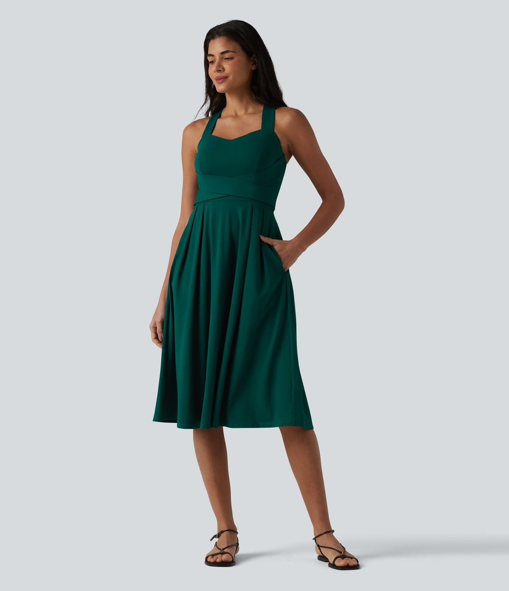 Robe midi fluide sans manches décolleté cœur avec bretelles croisées, nœud dans le dos et poches