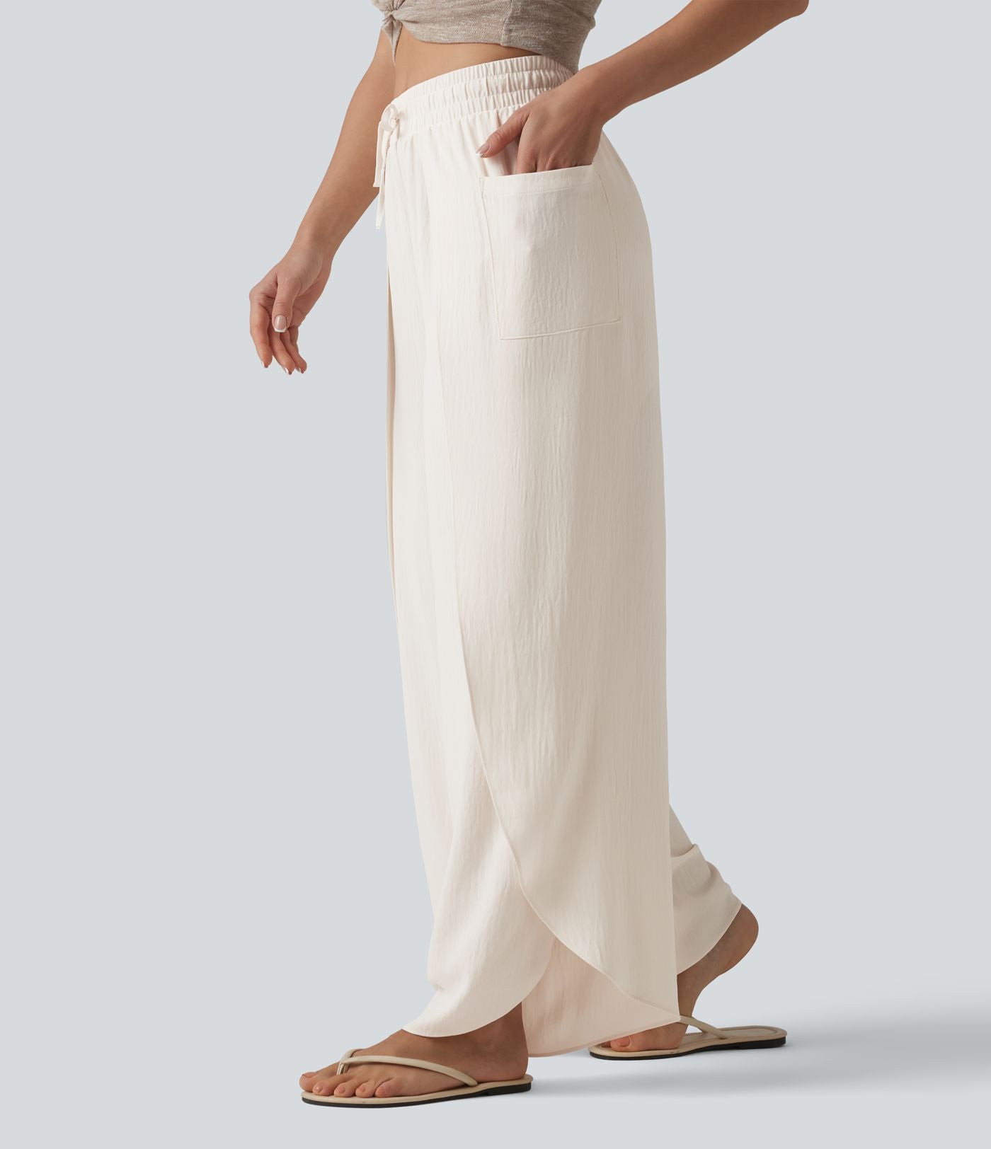 Pantalon ample décontracté à taille mi-haute, fentes, aspect lin, cordon de serrage et poches
