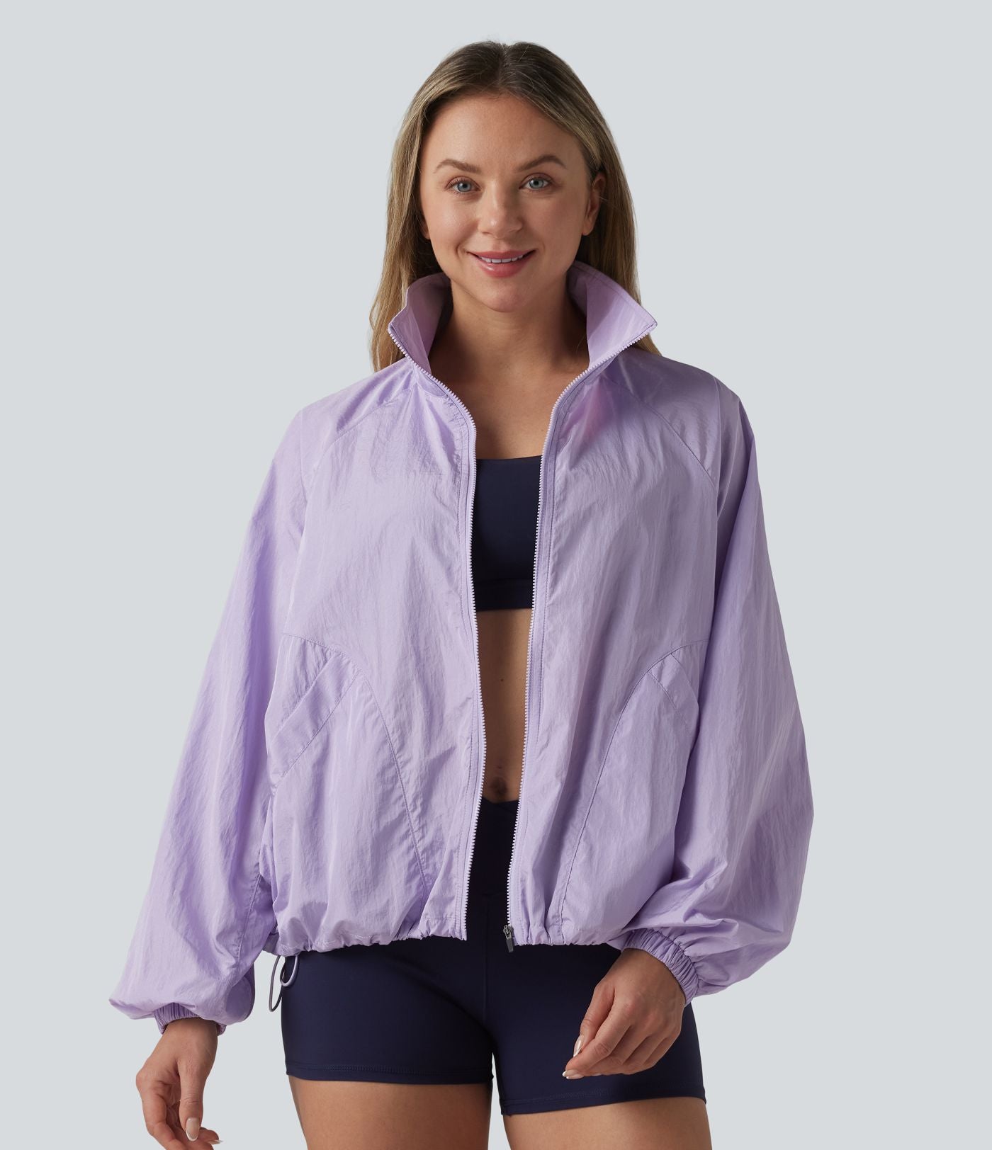 Veste de sport déperlante col montant manches longues zippée avec poches