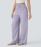 Pantalon large fluide taille haute avec cordon de serrage, poches latérales et aspect lin