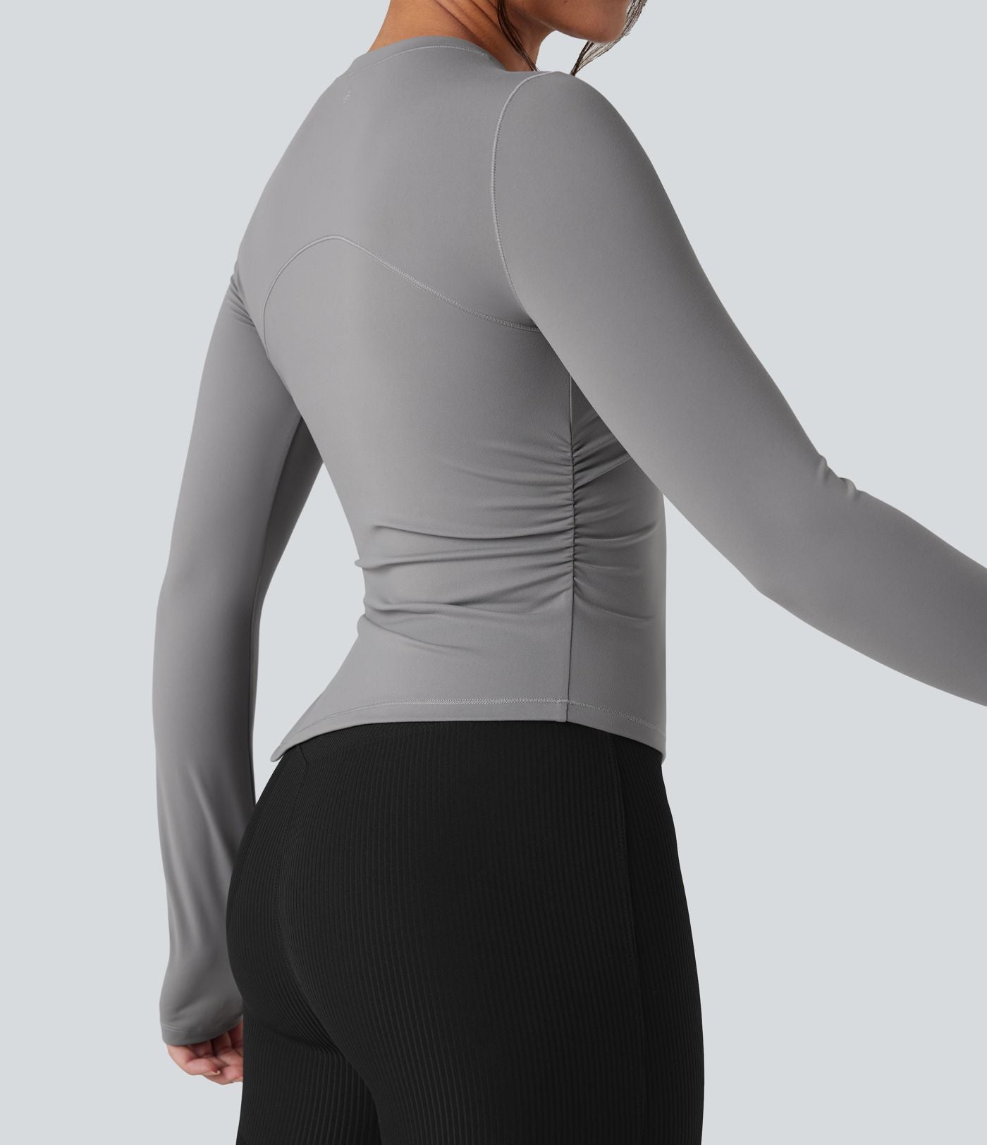 Top de sport yoga col rond ourlet asymétrique fendu manches longues avec trous pouces