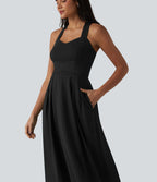 Robe midi fluide sans manches décolleté cœur avec bretelles croisées, nœud dans le dos et poches