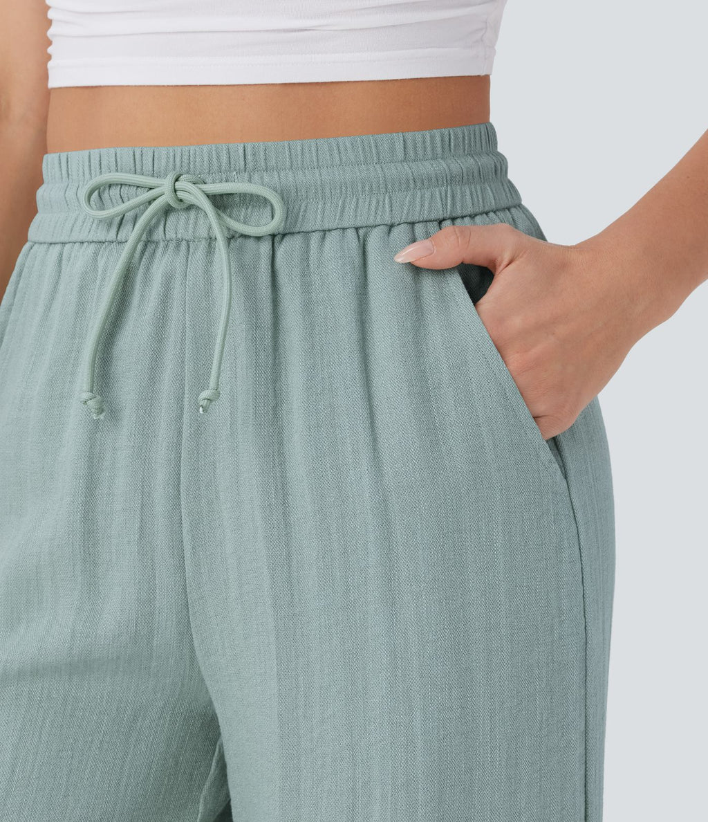 Pantalon large fluide taille haute avec cordon de serrage, poches latérales et aspect lin