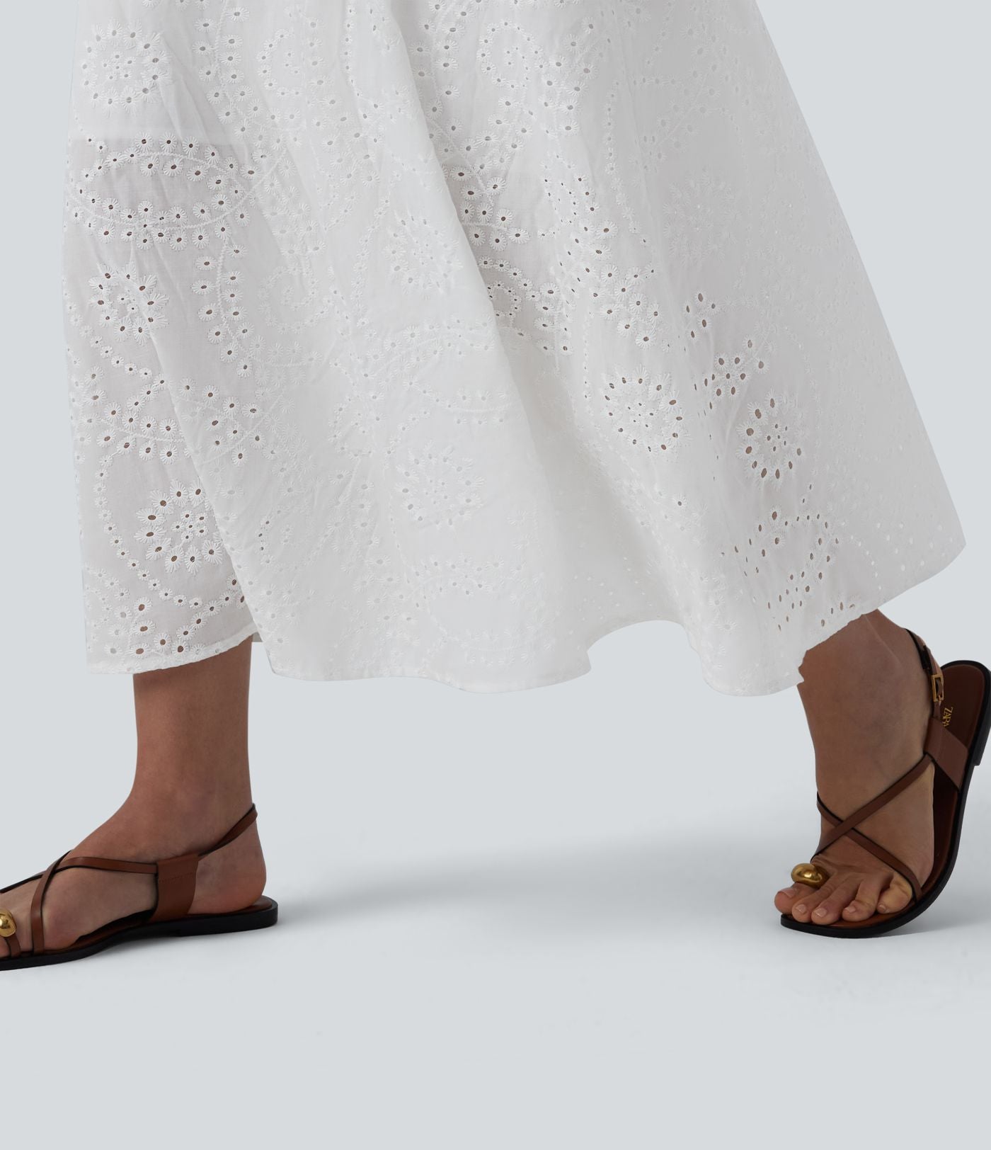 Robe mi-longue fluide col V sans manches avec nœud au dos
