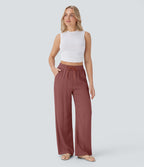 Pantalon large fluide taille haute avec cordon de serrage, poches latérales et aspect lin