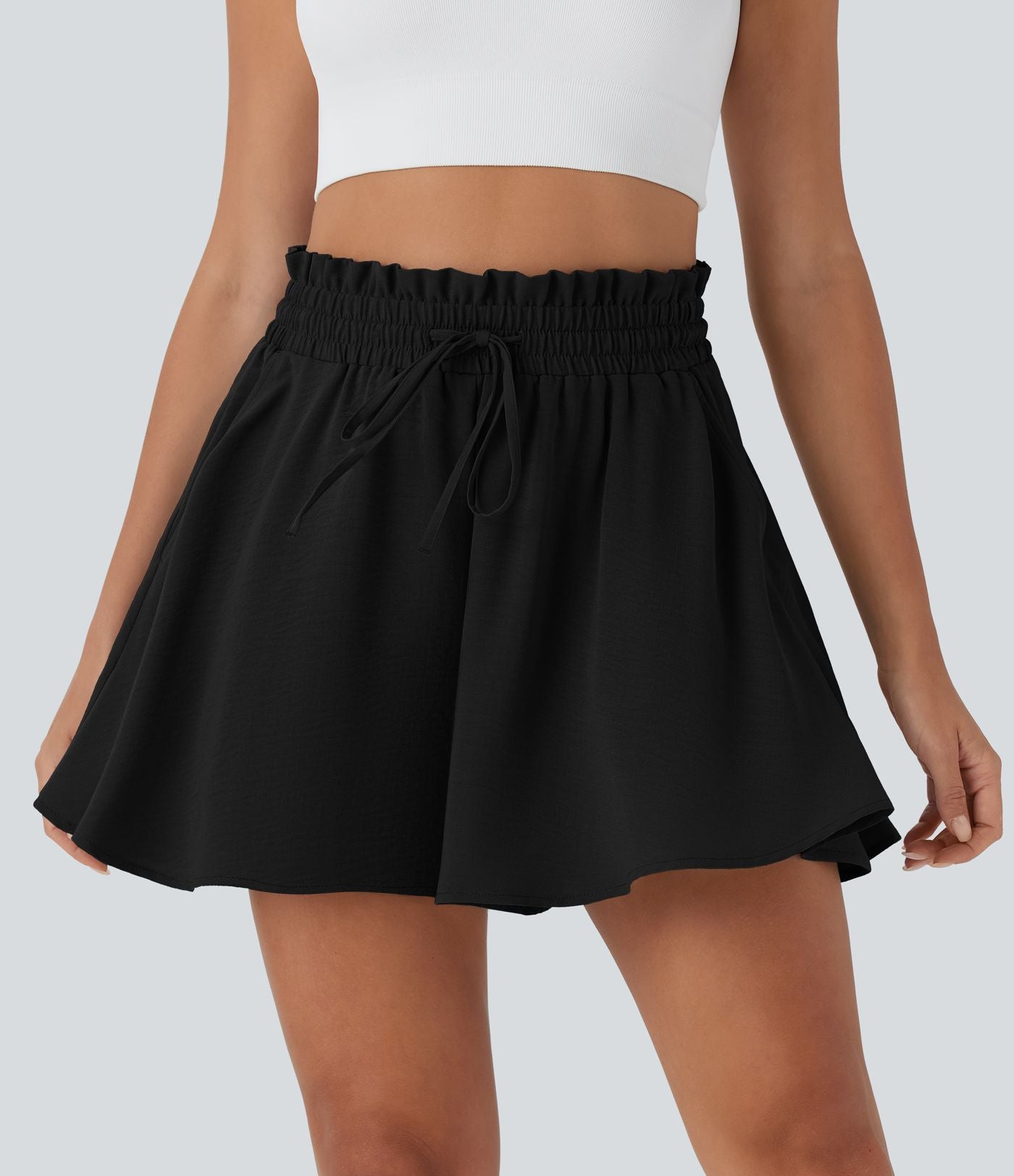 Short large décontracté taille haute façon paperbag avec cordon, poches latérales et aspect lin