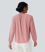 Blouse texturée col rond manches longues ourlet arrondi