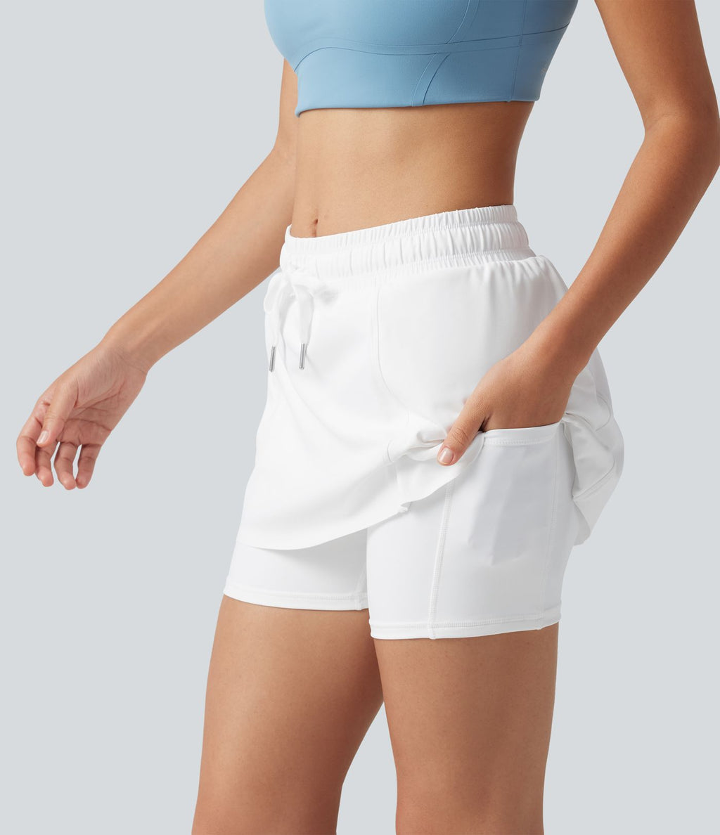 Jupe-short de sport mini SoftlyZero™ Airy taille mi-haute à ourlet croisé, toucher frais, cordon ajustable et poches