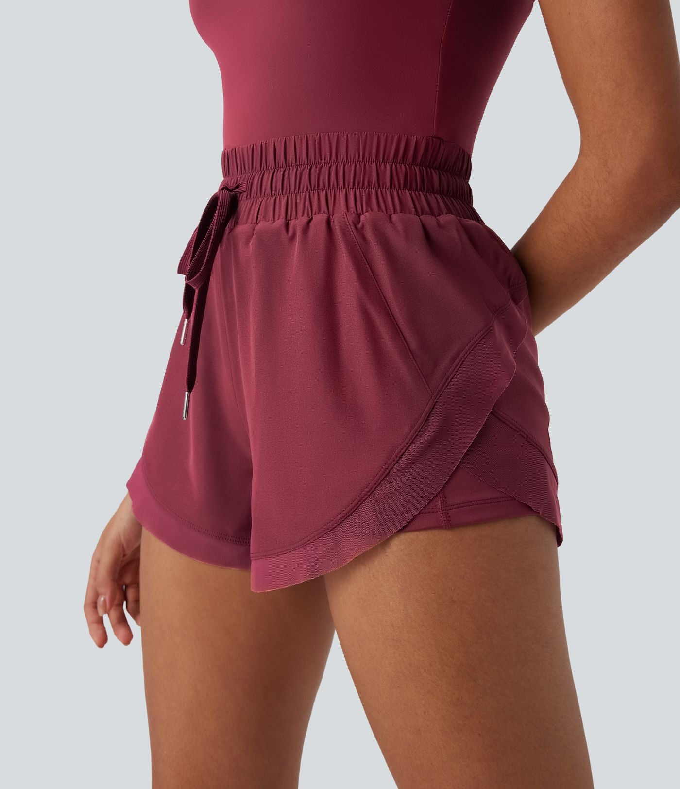 Combi-short de running 2-en-1 dos nu smocké avec cordon de serrage et poches latérales