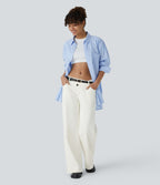 Halara Flex™ Jean large asymétrique taille basse avec bouton, fermeture éclair et poches multiples, délavé et extensible en maille