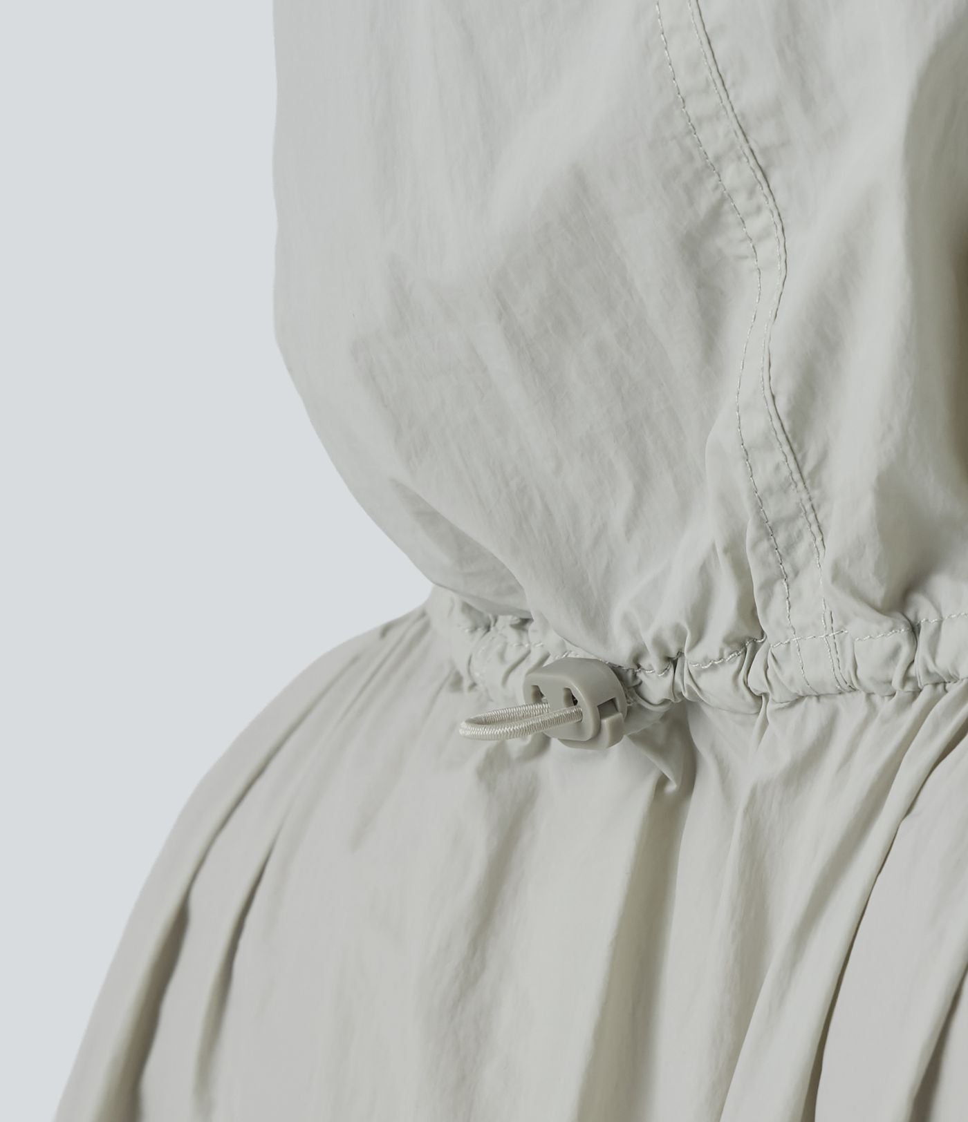 Veste de course légère à capuche manches longues avec poches, cordon de serrage et protection UPF 50+