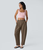 Pantalon tailleur ample, taille moyenne, coupe barrel, à poches
