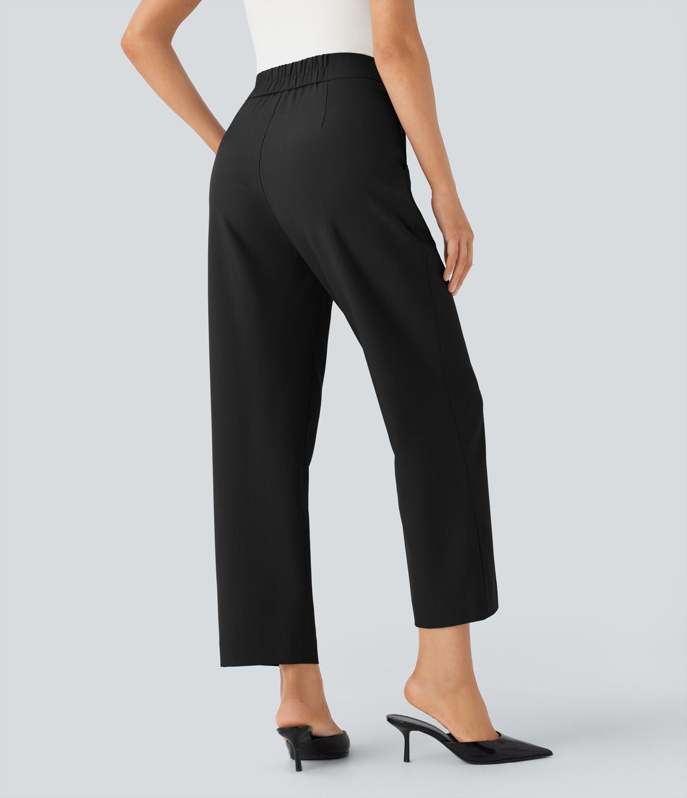 Pantalon tailleur taille haute froncé coupe fuselée avec poches et fermeture éclair invisible sur le côté