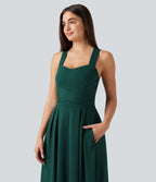 Robe longue fluide décontractée sans manches décolleté en cœur bretelles croisées avec lien dans le dos et poches