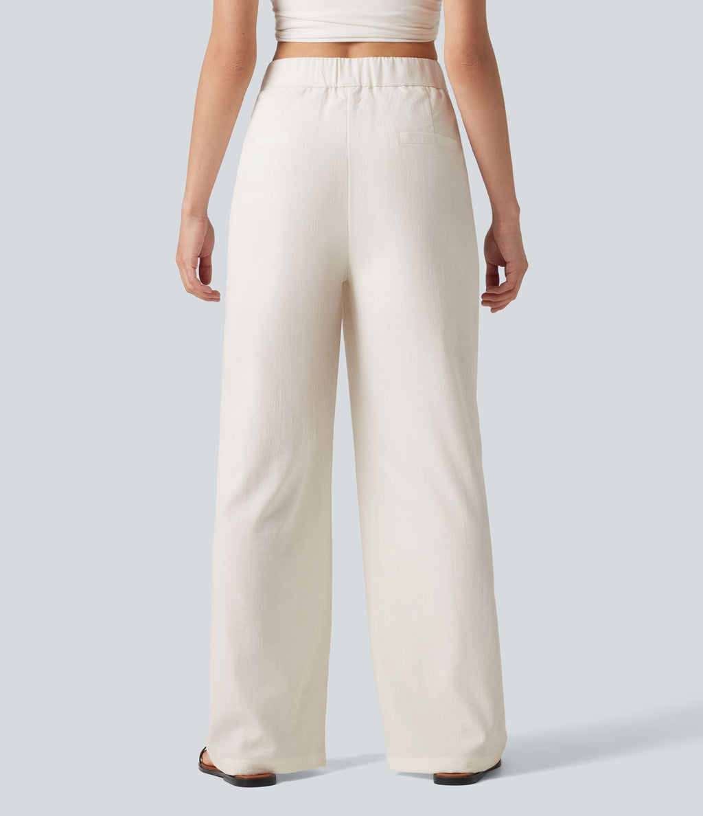 Pantalon large fluide asymétrique taille mi-haute plissé avec poches et aspect lin