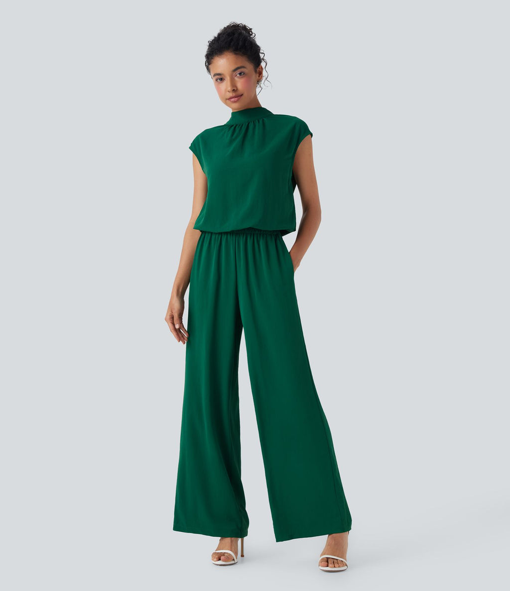 Combinaison pantalon tailleur jambes larges col montant dos goutte d'eau manches courtes avec poches latérales