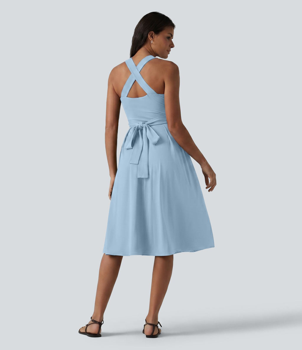 Robe midi fluide sans manches décolleté cœur avec bretelles croisées, nœud dans le dos et poches