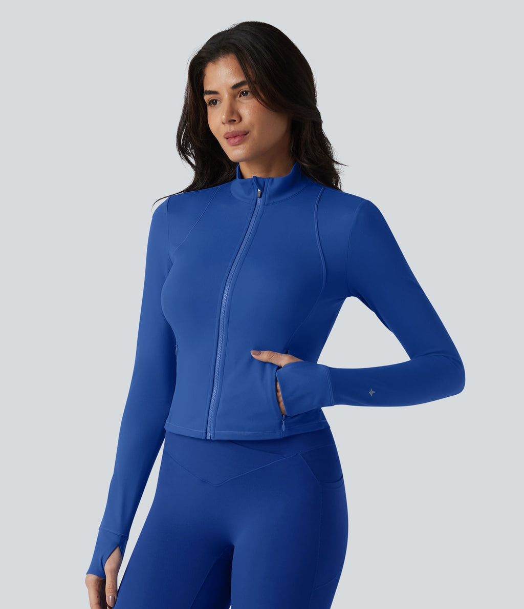 SoftlyZero™ Plush Veste de yoga col montant à manches longues avec trous pour les pouces, dos torsadé, empiècements en mesh respirant et poches