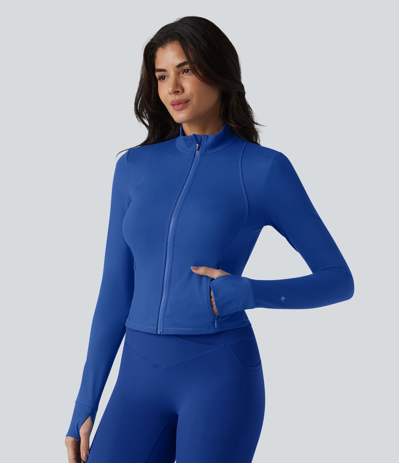 SoftlyZero™ Plush Veste de yoga col montant à manches longues avec trous pour les pouces, dos torsadé, empiècements en mesh respirant et poches