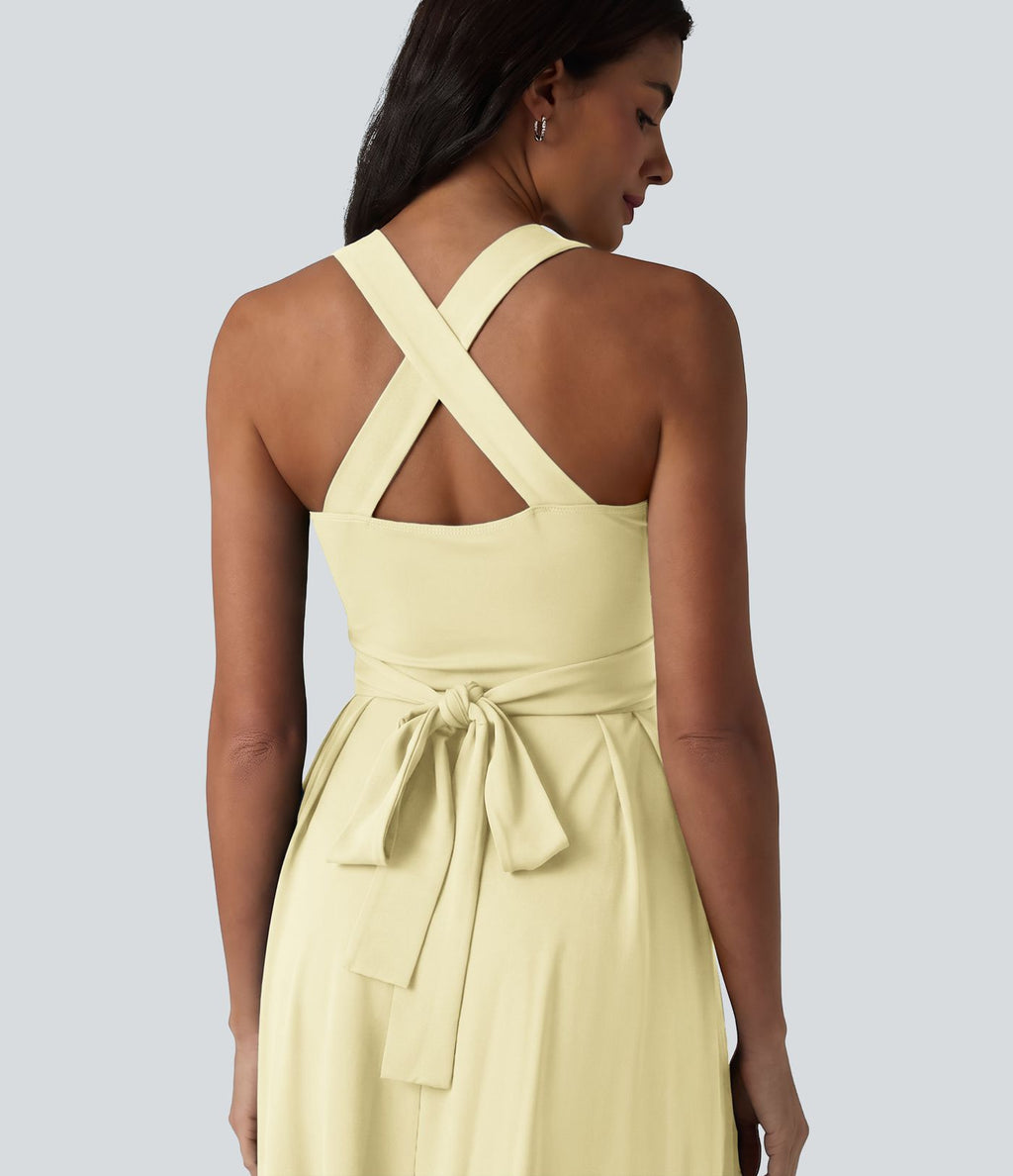 Robe midi fluide sans manches décolleté cœur avec bretelles croisées, nœud dans le dos et poches