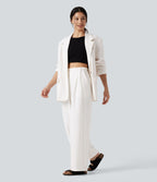 Pantalon tailleur large, taille haute, à poches