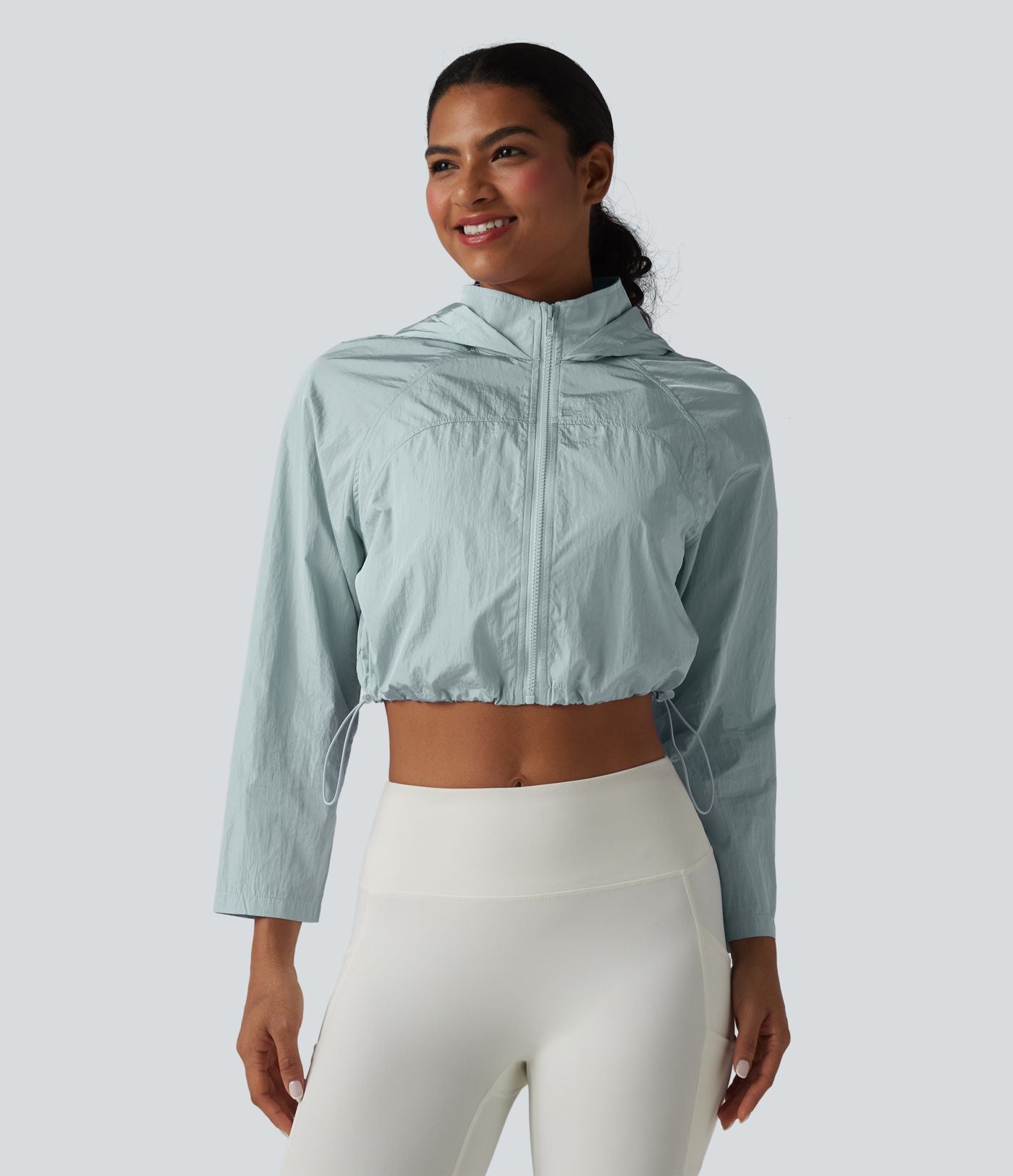 Veste de running 3-en-1 déperlante à capuche avec trous pour les pouces, ourlet arrondi et poches