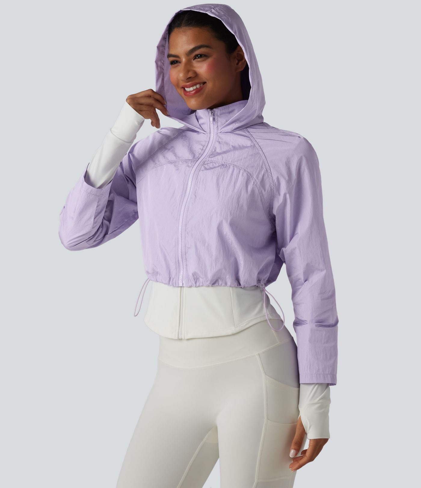 Veste de running 3-en-1 déperlante à capuche avec trous pour les pouces, ourlet arrondi et poches