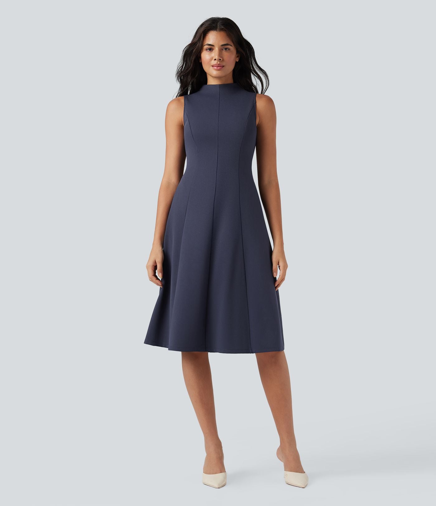Robe mi-longue col montant sans manches avec poches