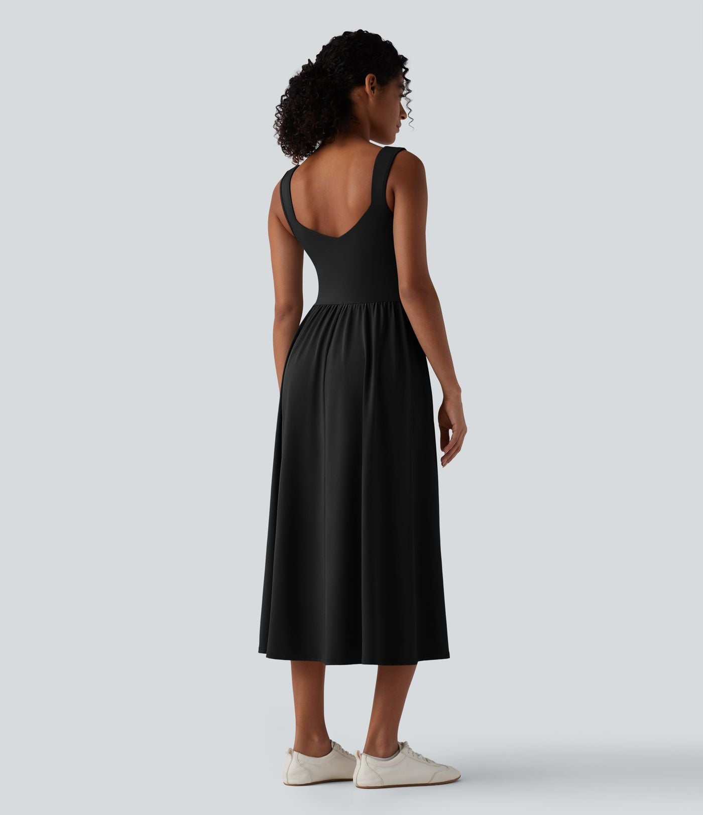 Robe midi fluide sans manches dos croisé ouvert avec poches