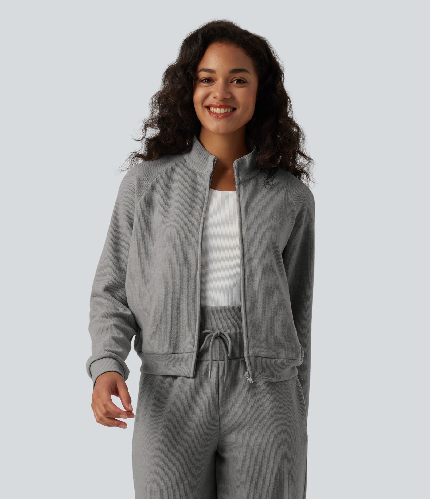 Veste casual côtelée à col montant, manches longues et fermeture zippée avec poches