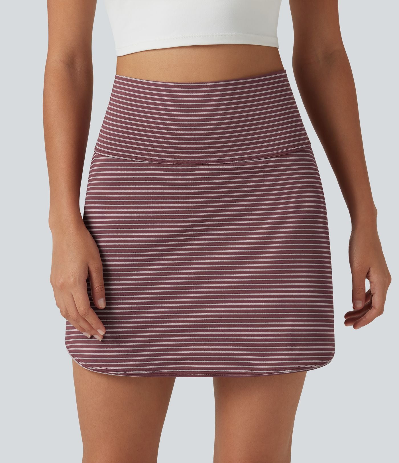 Mini-jupe de golf 2 en 1 à rayures, taille ultra haute, effet ventre plat, ourlet arrondi et poches