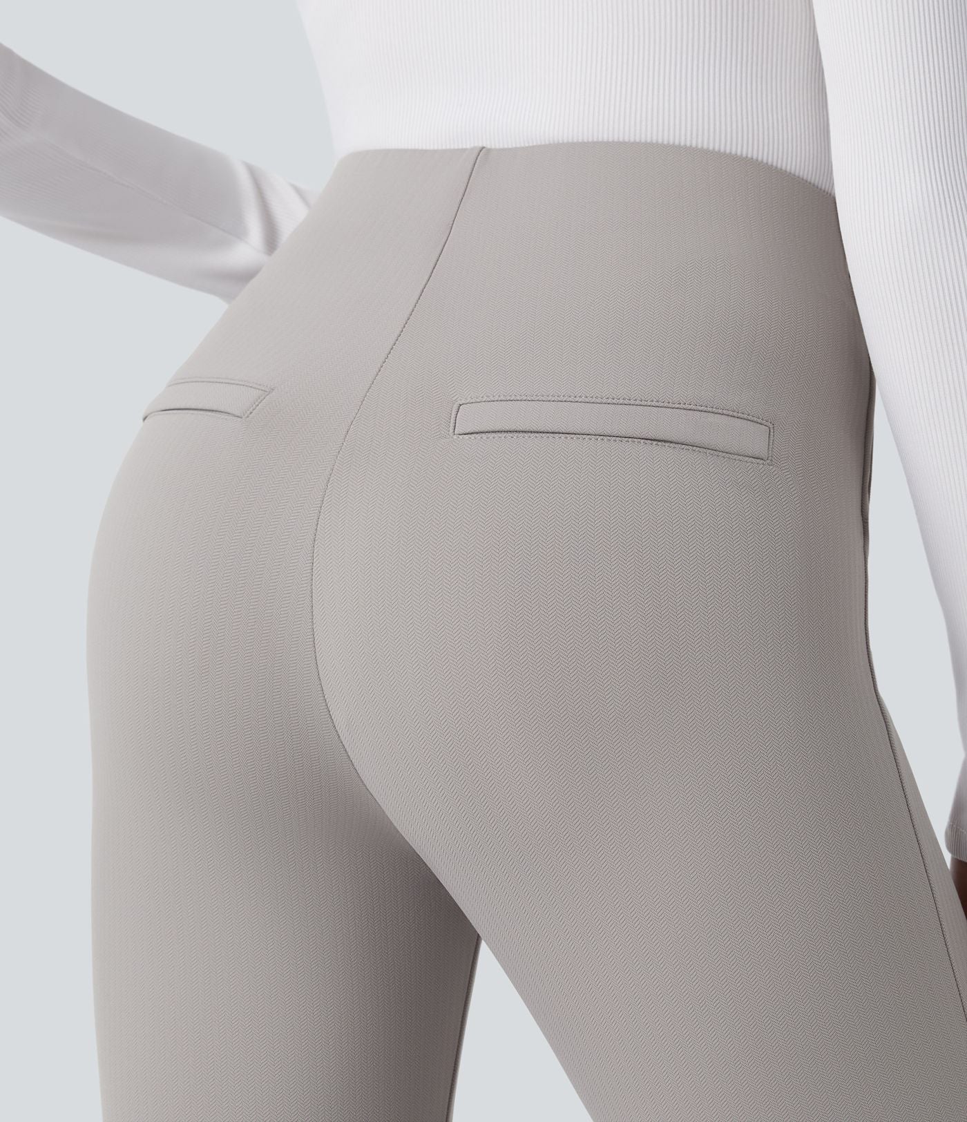 Pantalon tailleur skinny gainant taille haute à chevrons avec poches arrière zippées décoratives