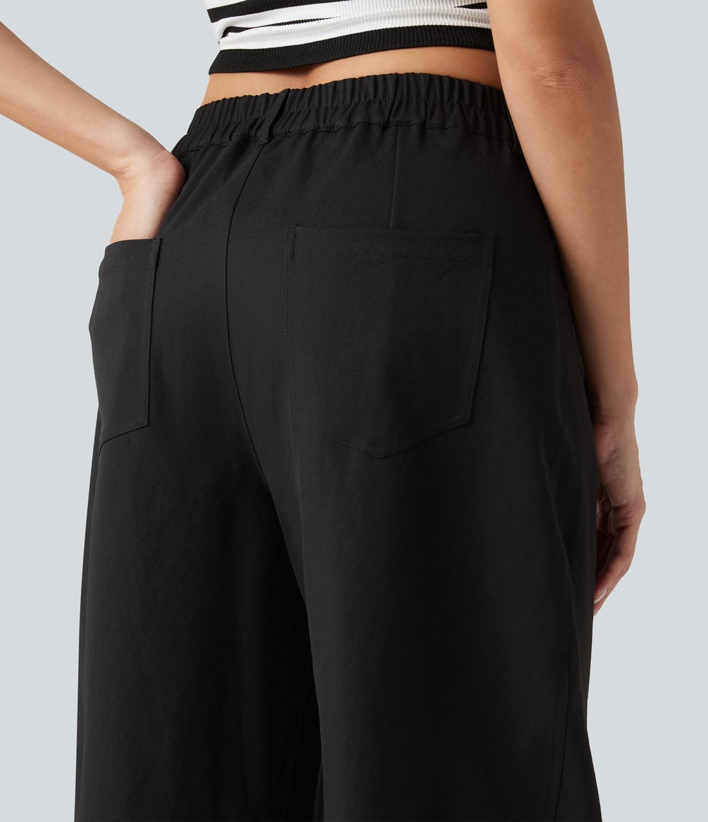 Pantalon décontracté à taille mi-haute, coupe ample et jambes fuselées, avec poches