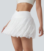 Jupe-short de tennis mini taille haute croisée fluide avec poches