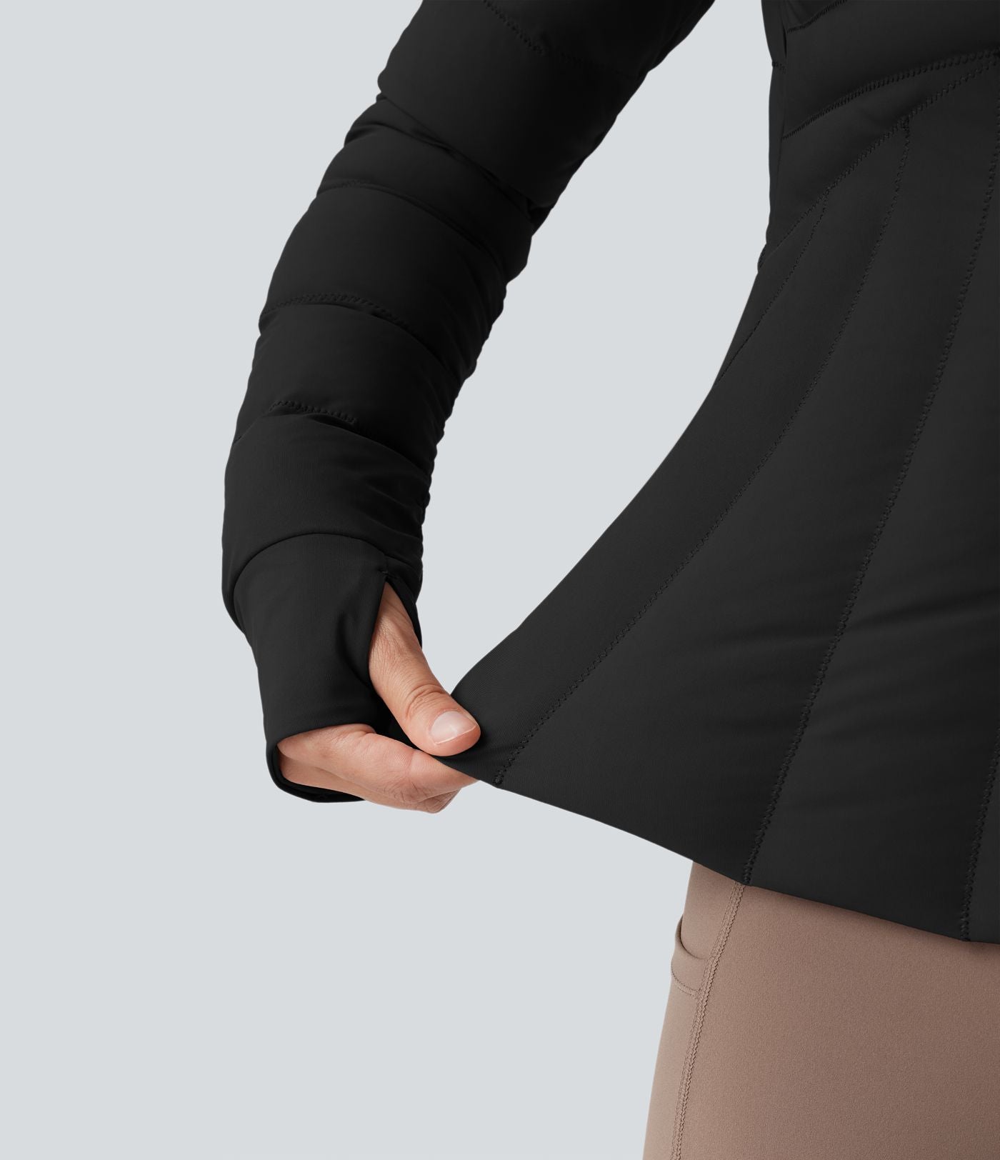 Doudoune de sport extensible col montant avec passants pouces et poches