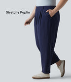 Pantalon grande taille en popeline stretch taille haute, plissé avec ourlet roulotté, longueur 7/8, coupe fuselée, avec poches