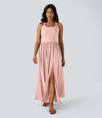 Robe longue fluide fendue avec poches latérales, dos nu et effet torsadé