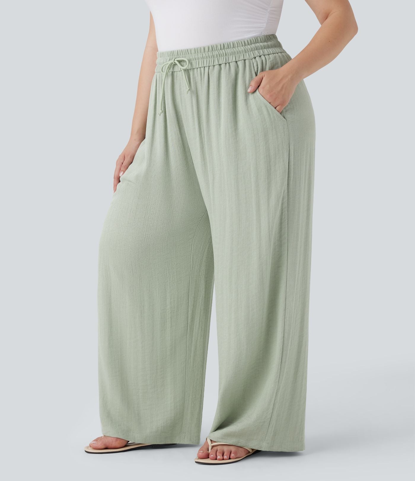 Pantalon décontracté grande taille large fluide taille haute effet lin avec cordon de serrage et poches