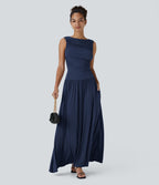 Robe longue à encolure bateau, bretelles asymétriques, côtés froncés et poches