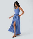 Robe longue fluide fendue avec poches latérales, dos nu et effet torsadé