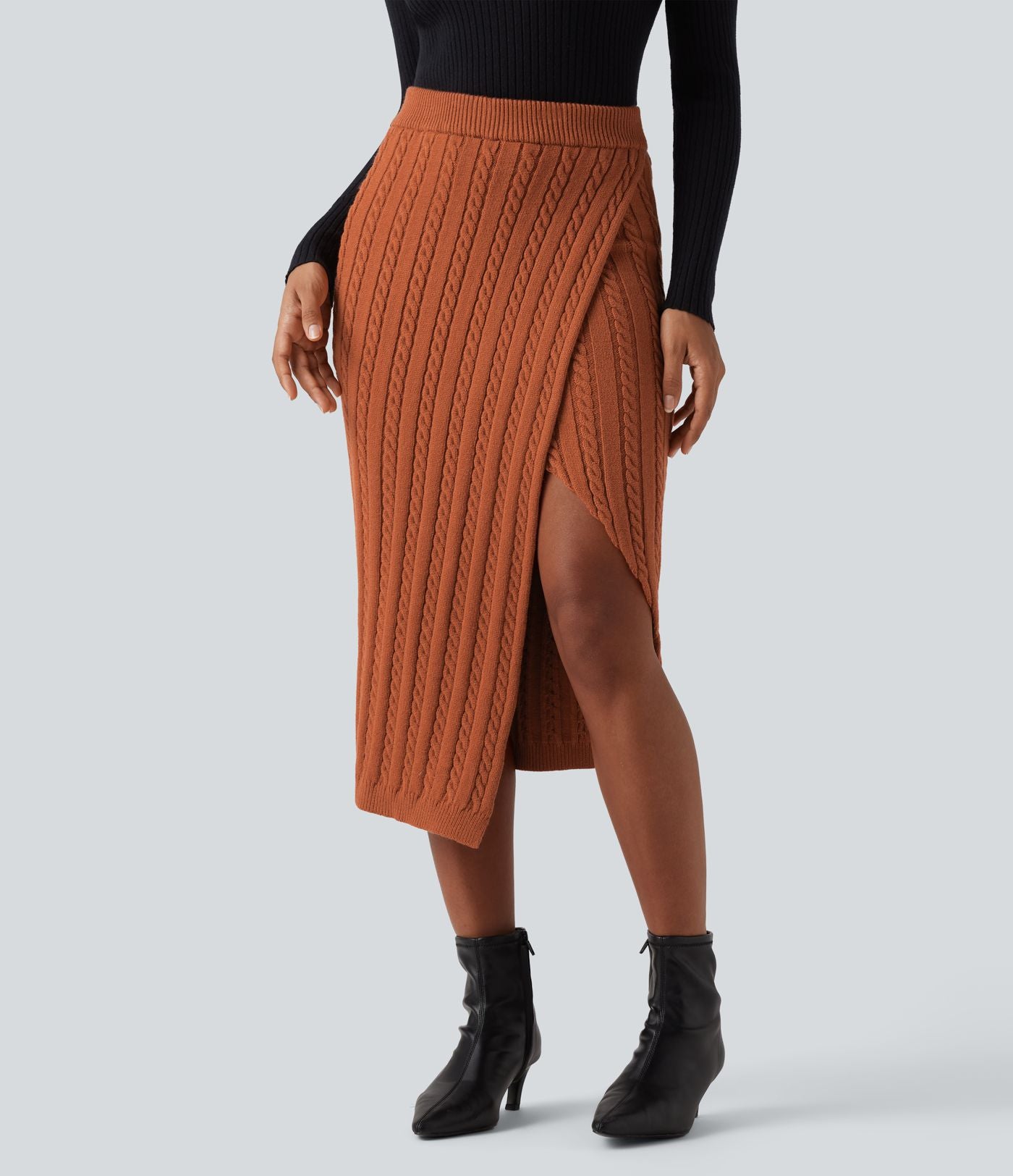 Jupe pull moulante mi-longue taille haute en maille torsadée avec fente