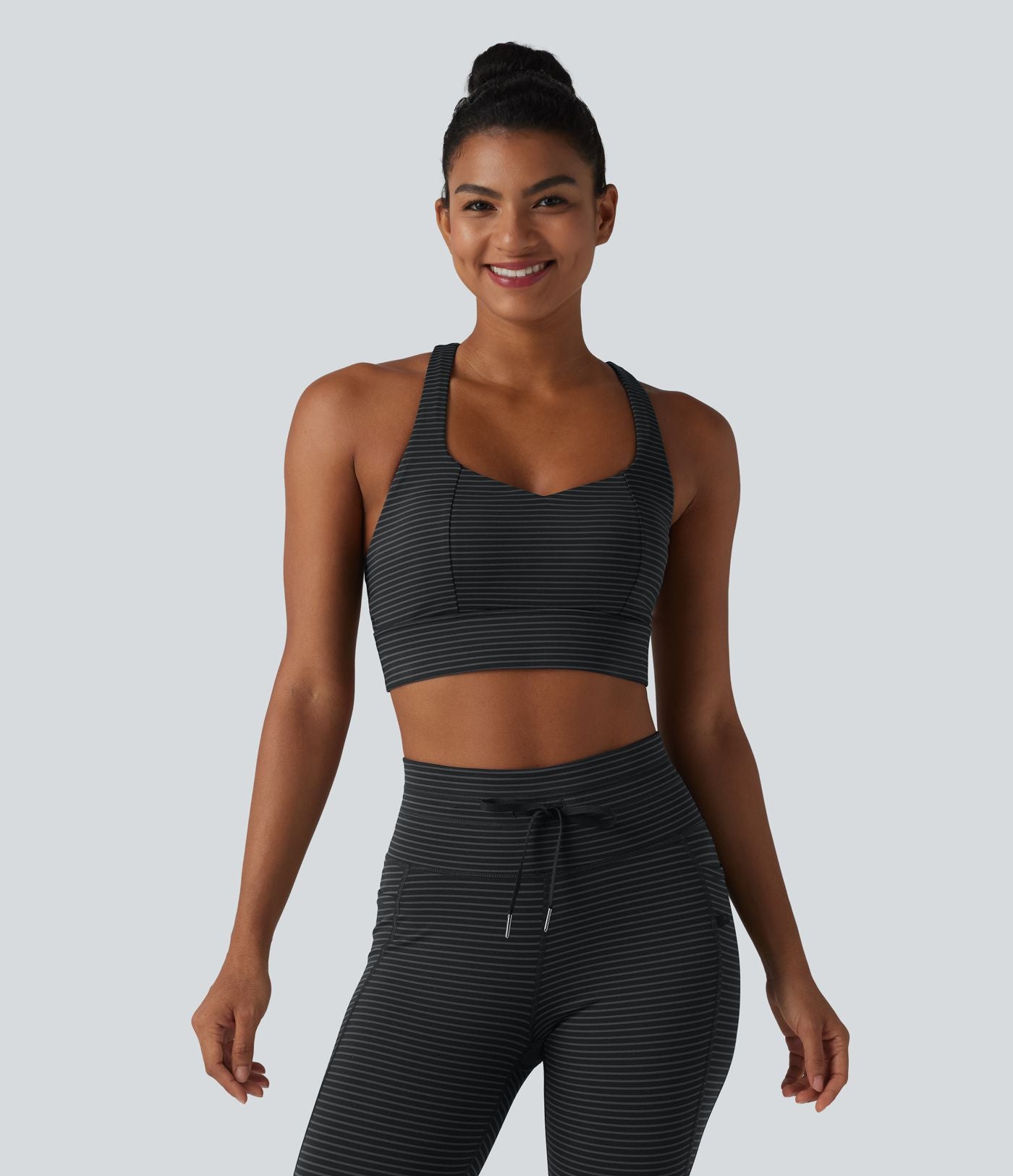 Brassière de sport yoga à rayures dos nageur croisé maintien léger avec soutien-gorge intégré