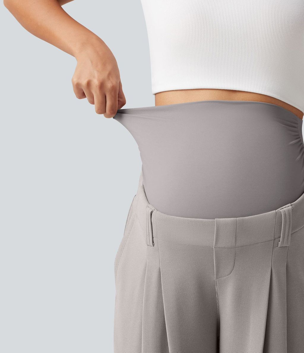 Pantalon de grossesse fuselé taille très haute en tissu gaufré avec poches