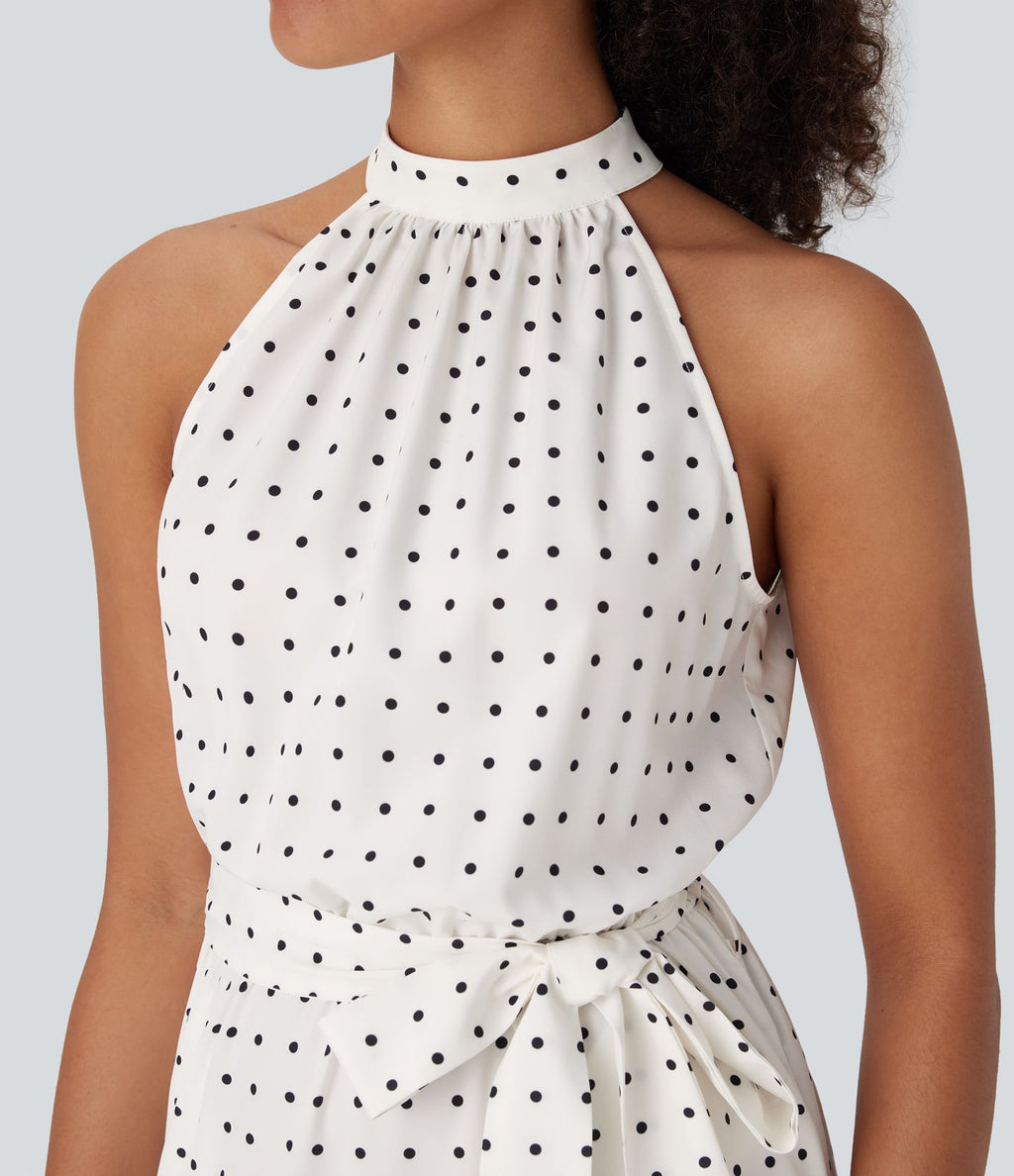 Robe mi-longue fluide de vacances à pois avec col licou, découpe dos, ceinture et poches latérales
