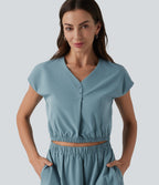 Robe col V manches courtes à découpes en popeline extensible avec poches