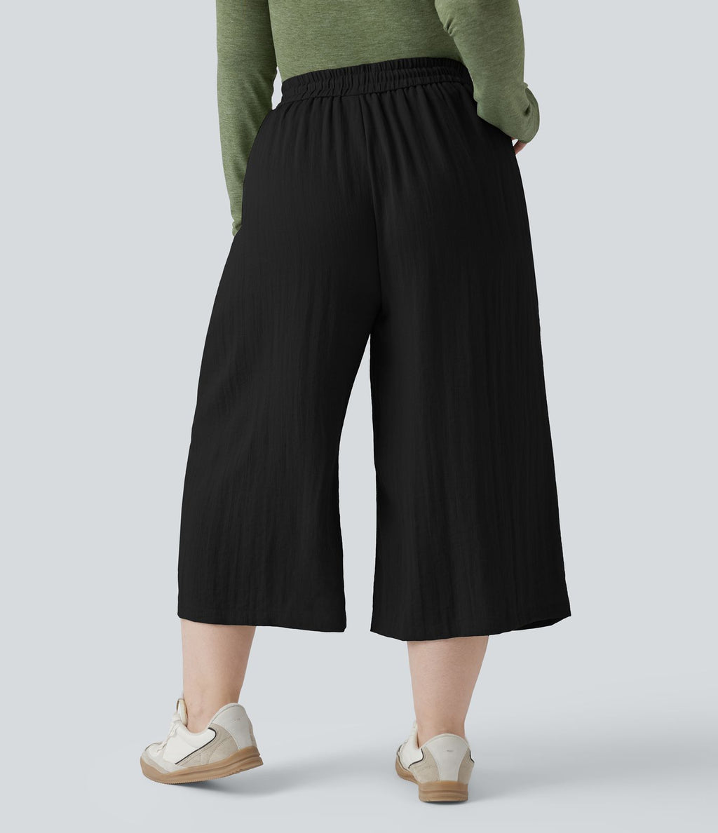 Pantalon grande taille large fluide taille haute avec cordon de serrage, poches et aspect lin