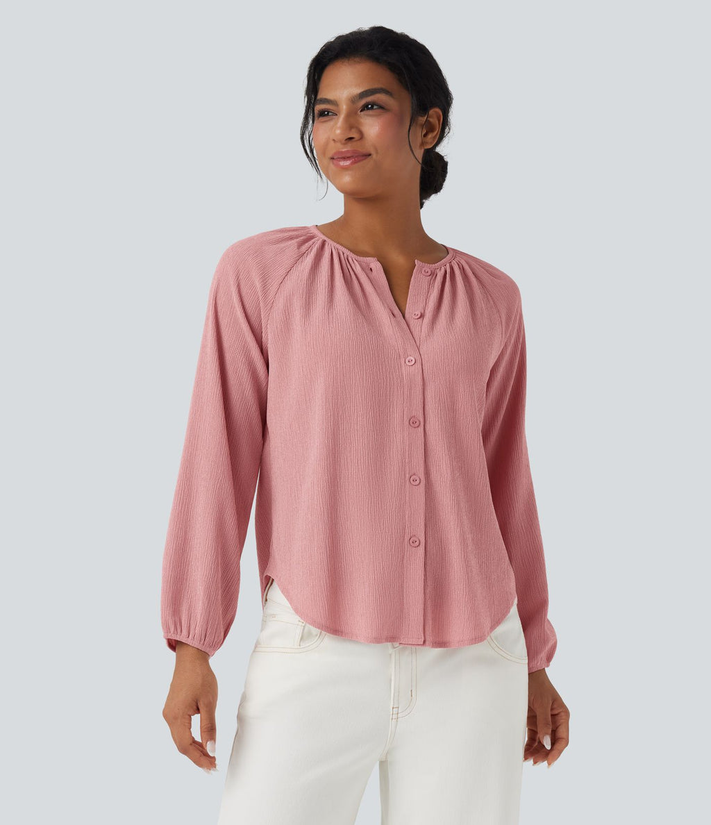Blouse texturée col rond manches longues ourlet arrondi